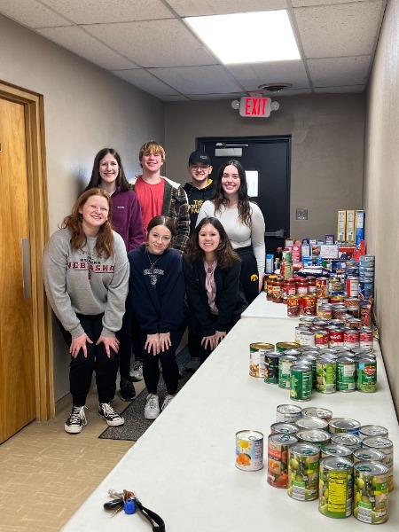JOI Students collected over 400 food items for the local panty. Front Row: Anna W, Monica O, Reese C. 
Back Row: Delaney W, Kyle B, Gabe W, Haley N